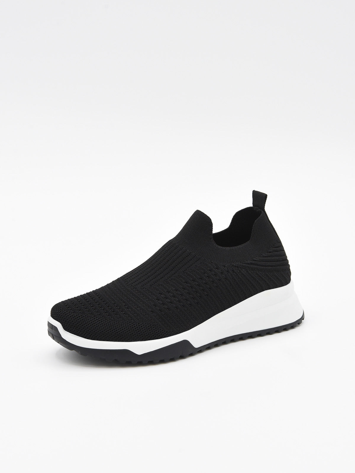 Zapatilla slip on negra de punto con suela blanca